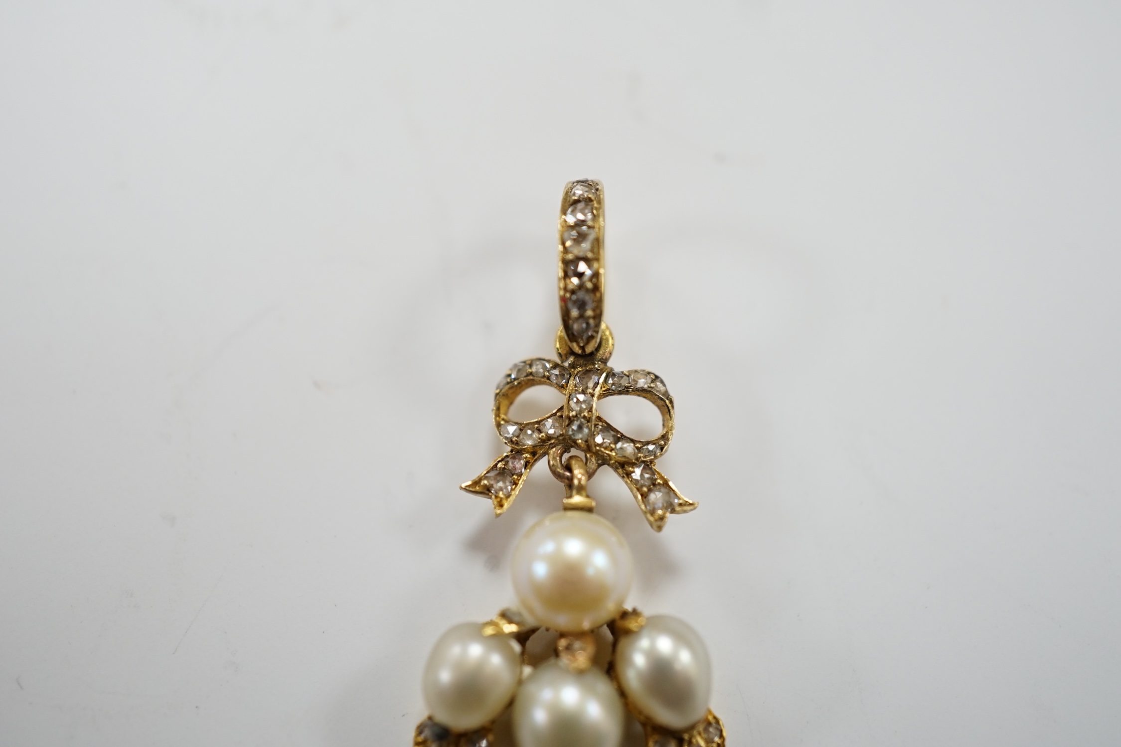 A yellow metal, cultured pearl and rose cut diamond cluster set drop pendant, 34mm, gross weight 3.4 grams.